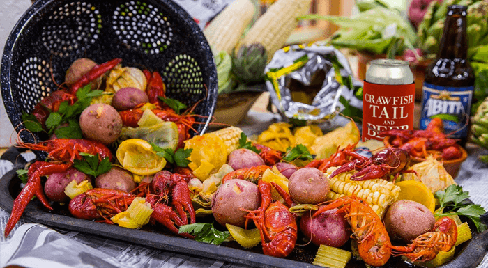 Custom koozies and table set with crawfish boil spread