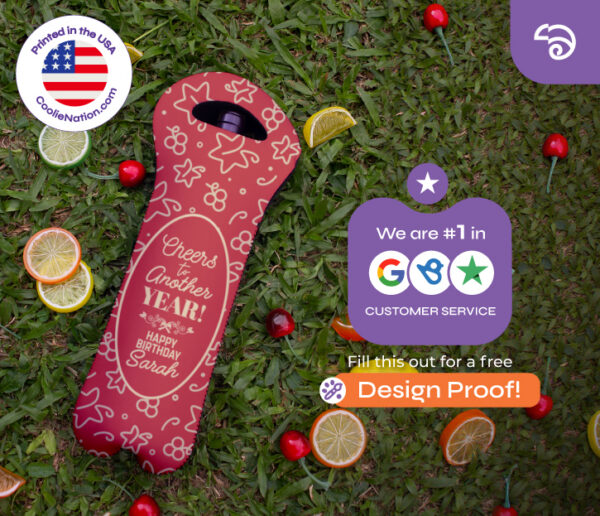 Red personalized wine bottle cooler for birthday with custom name and message, displayed on grass with fruit accents, by CoolieNation.