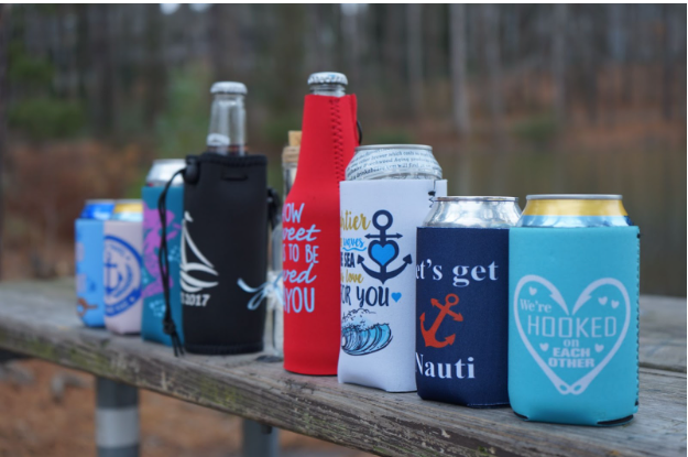 Personalized nautical wedding koozies with a custom anchor design and beach colors