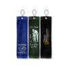 Three custom CoolieNation golf towels with grommets and clips: a blue Pinehurst Golf Club towel, a green Best Dad by Par towel, and a black Depp & Associates tournament towel.