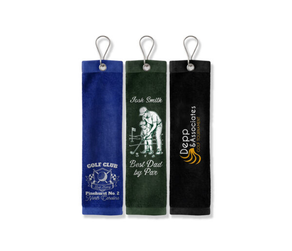 Three custom CoolieNation golf towels with grommets and clips: a blue Pinehurst Golf Club towel, a green Best Dad by Par towel, and a black Depp & Associates tournament towel.