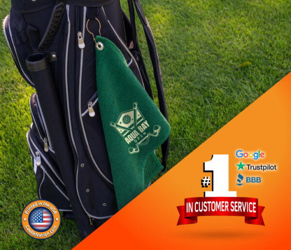 Personalized golf towel placed over a golf bag