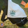 Custom golf towel draped over a golf bag