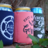 Three custom wedding koozies featuring the words "bike" and "heart" on them, perfect for keeping your drinks cool.