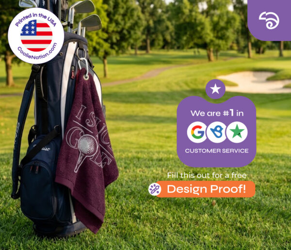 Maroon custom golf towel clipped to a bag on the fairway with an I Suck at Golf design. CoolieNation is rated #1 in Google customer service. Free design proof available.