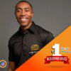 Black shirted man on orange background, wearing personalized uniform