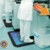 Person in a lab standing on a custom diamond surface anti-fatigue mat