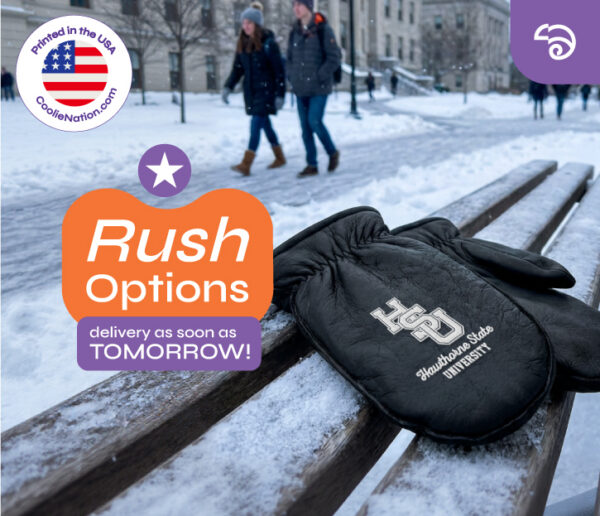 Black custom leather choppers with university logo engraving on snowy bench, showcasing rush delivery option for winter merchandise