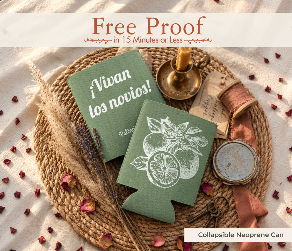 Two sage green neoprene wedding can coolers with lemon and orange illustration and ¡Vivan los novios! on a woven tray with dried flowers, a personalized wedding favor styled for Pinterest.